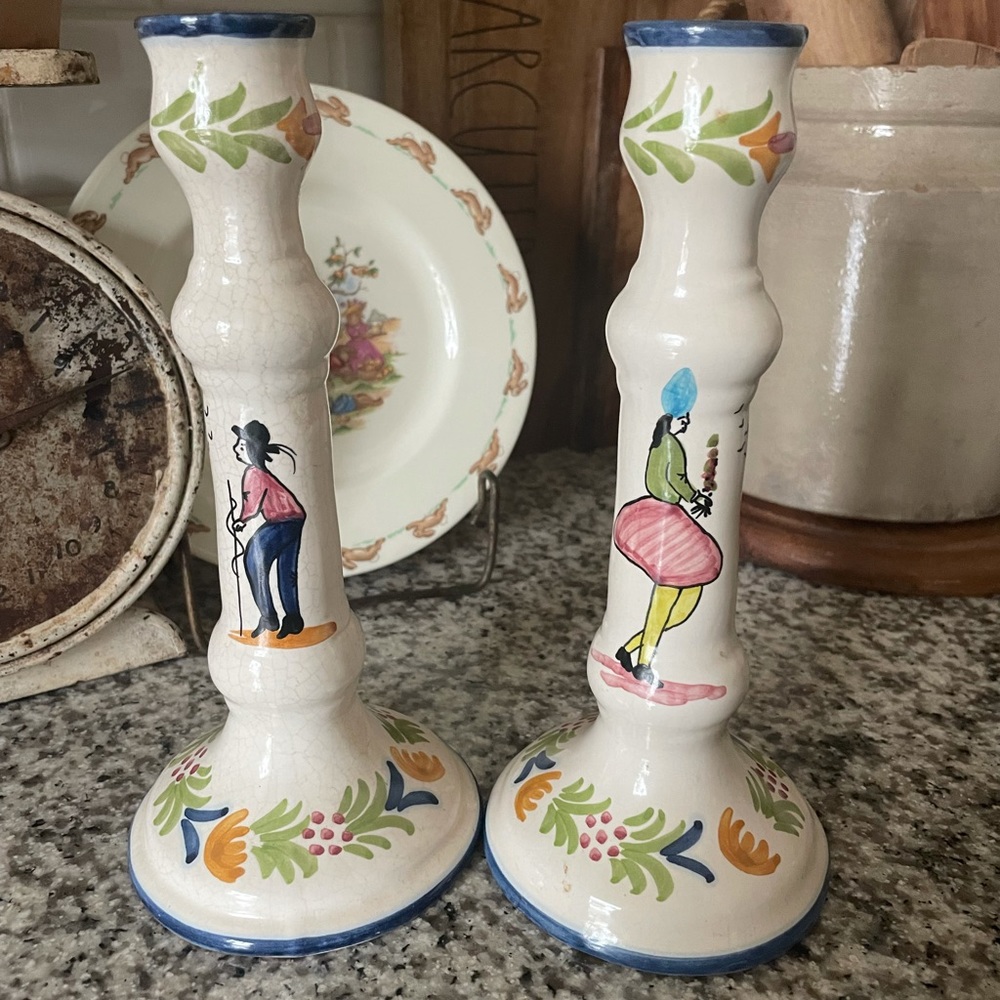 Hand painted taper holders .